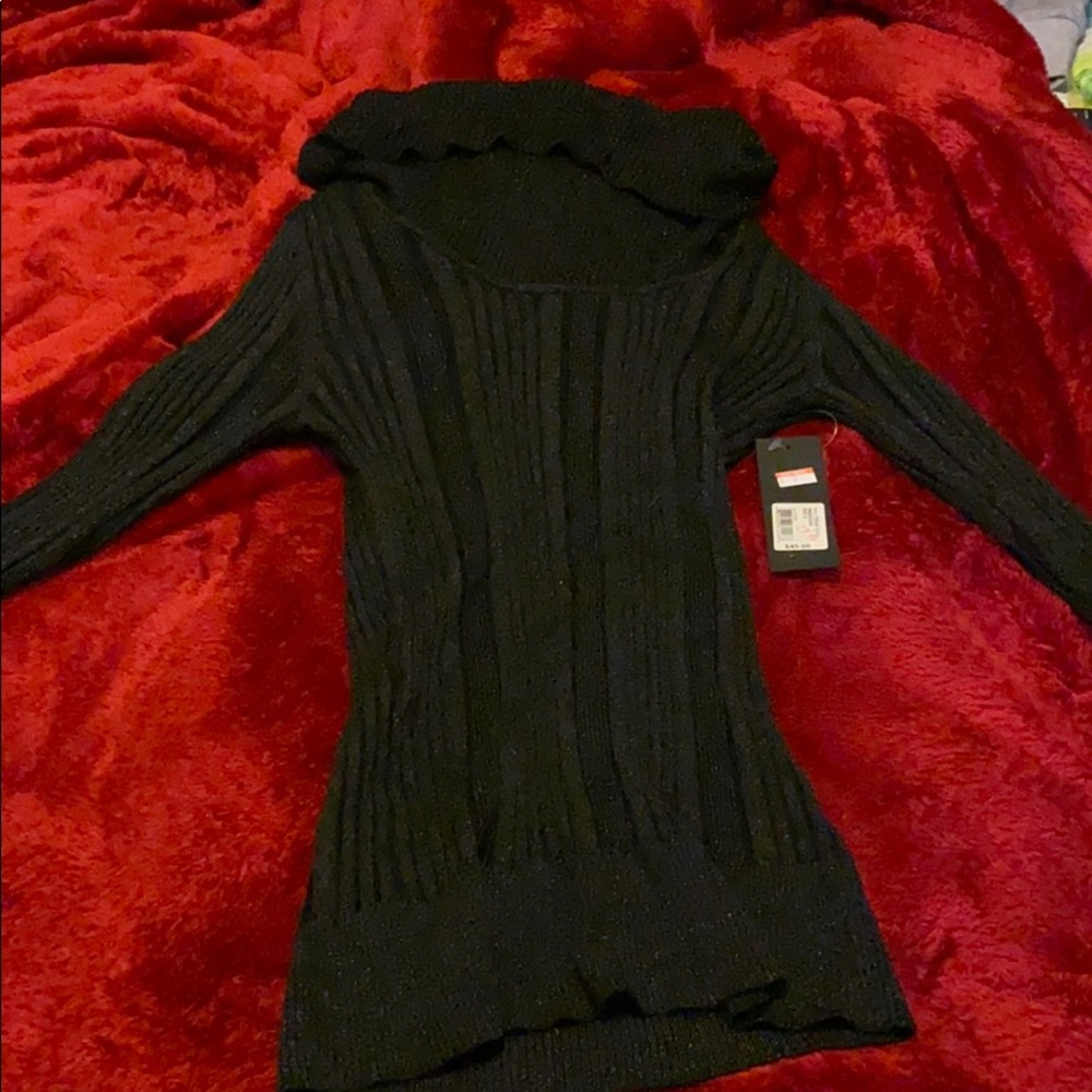 Glittery black turtle neck. Never worn.